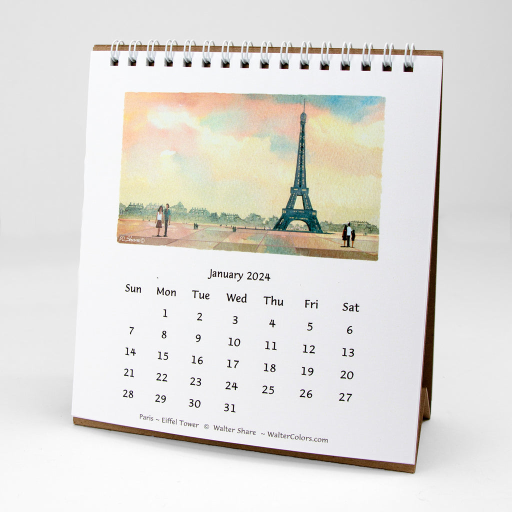 A watercolor image for the Eiffel Tower stands on a desktop calendar.